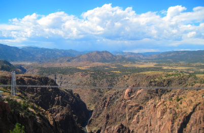 Royal Gorge Bridge in the distance over the gorge on a bright blue sunny day near Happy Acres RV Park Pueblo CO